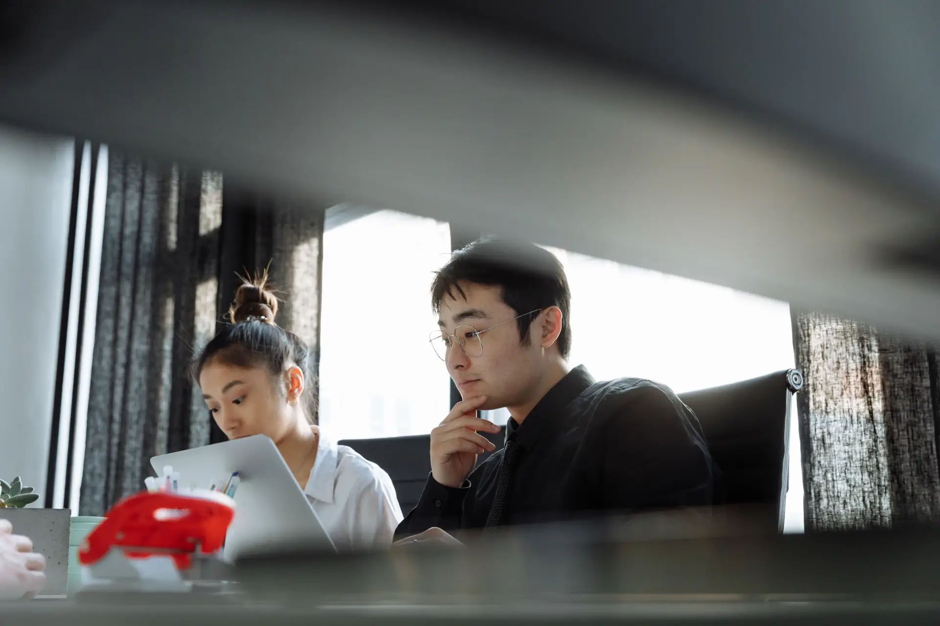 Group of young professionals collaborating in a creative and modern office space.
